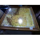 A square coffee table having a mapped top of the Dominion of Canada, with a painted oak cupboard