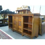 Doveston, Bird and Hull; an Aesthetic movement walnut sideboard with mirrored superstructure,