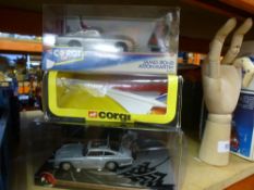 A Corgi James Bond car, a further Bond car and a Concorde