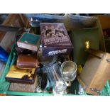 A box of mixed collectables, including cameras, car badges, wooden boxes