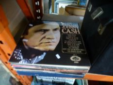 A quantity of vinyl LPs of mixed genre to include Johnny Cash, Burt Bacharach, The Carpenters, Abba,