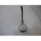 A silver pocket watch marked 925, with an enamel face displaying a steam engine