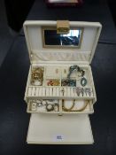 Cream jewellery box containing costume rings, bracelets, etc