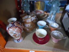 A quantity of Aynsley china cups, saucers, plates, along with two figures and an oriental vase