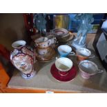 A quantity of Aynsley china cups, saucers, plates, along with two figures and an oriental vase