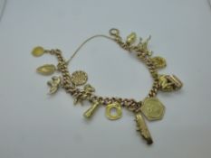 9ct yellow gold charm bracelet hung with 14 gold charms including ship, elephant, Pegasus, etc