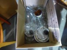 A box of mostly glass items with some china plates