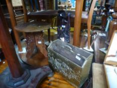 A small carved table, a carved figure and a brass magazine rack