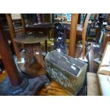 A small carved table, a carved figure and a brass magazine rack