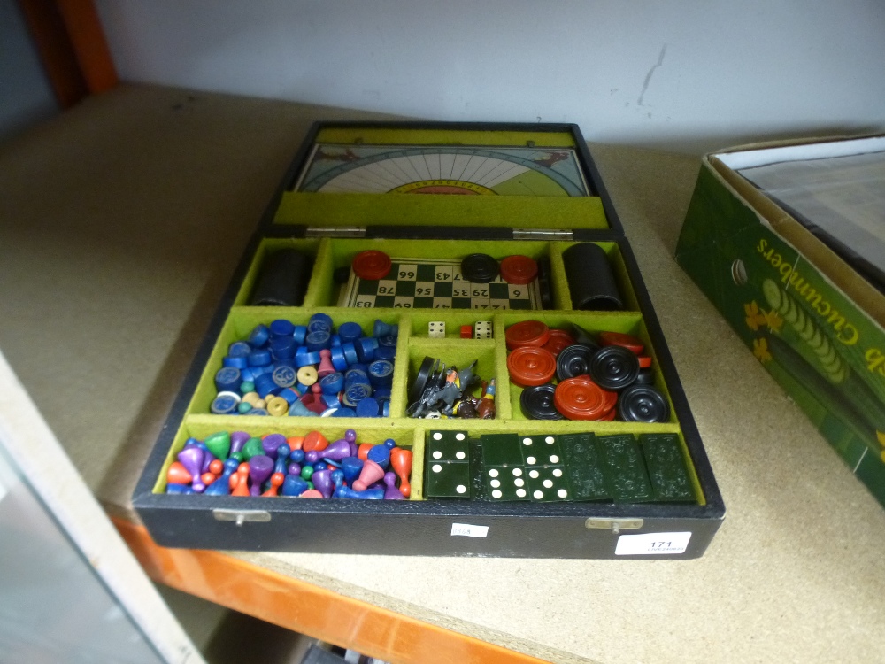 A cased vintage compendium of games, to include drafts, chess and dominoes, etc