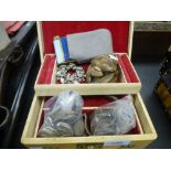 A jewellery box containing coins, a compact and sundry