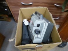 A box of mixed camera and projector equipment