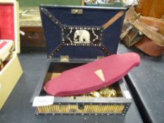 A porcupine quill box containing a small quantity of costume jewellery
