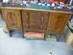 A 20th century mahogany sideboard, having two central drawers on square legs