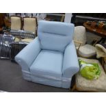 A brand new pale blue armchair by HARVEYS on pine bun feet, with original receipt