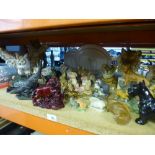 A quantity of animal figurines to include tigers, fox, otters and owls, etc