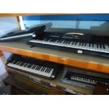 Two Yamaha electric keyboards and two others