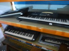 Two Yamaha electric keyboards and two others