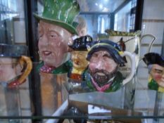 Two Beswick Toby jugs, with other examples and a Royal Doulton jug