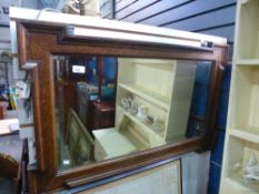 A 1930's oak oblong wall mirror and a quantity of pictures