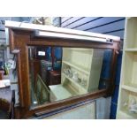 A 1930's oak oblong wall mirror and a quantity of pictures