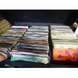 A large case of vinyl 7" singles covering the 60s-70s