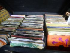 A large case of vinyl 7" singles covering the 60s-70s
