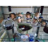 A quantity of Royal Doulton Toby jugs, a Wedgwood lidded dish, Caithness paperweights, etc