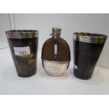 An interesting set with a pair of beakers and a hip flask, all engraved. both beakers made from