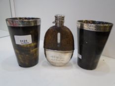 An interesting set with a pair of beakers and a hip flask, all engraved. both beakers made from