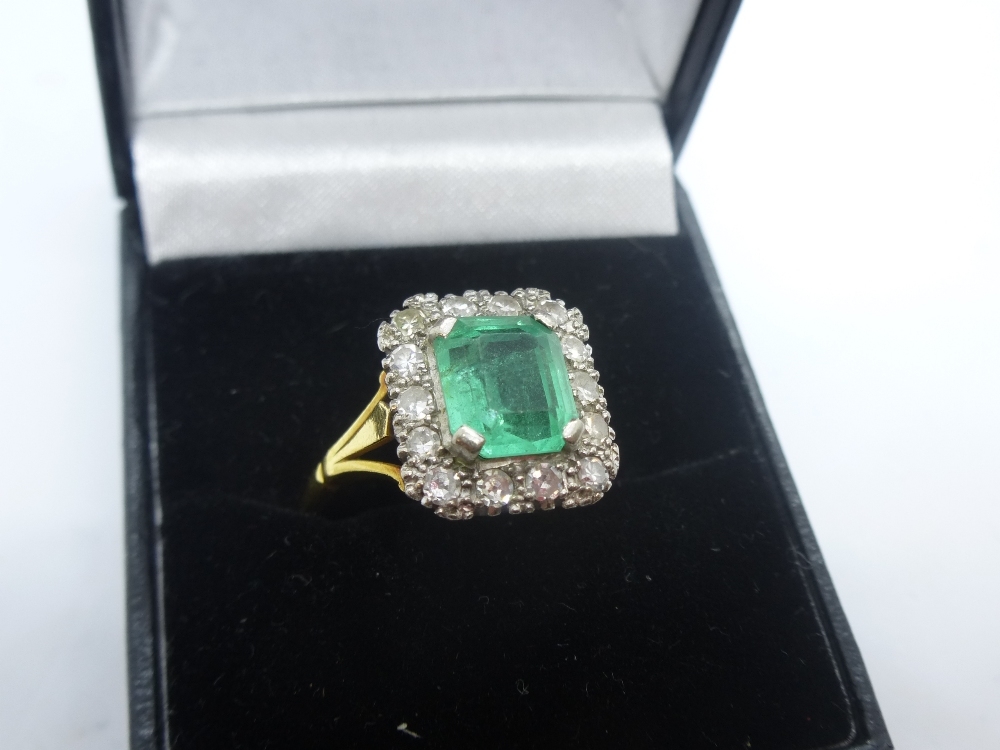 18ct yellow gold ring with cushion set emerald surrounded by diamonds, marked 18, size S, total