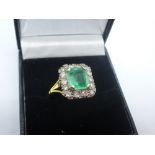 18ct yellow gold ring with cushion set emerald surrounded by diamonds, marked 18, size S, total