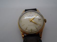 Vintage gent's Accurist 21 jewell automatic wristwatch, possibly 9ct on brown leather strap, surface