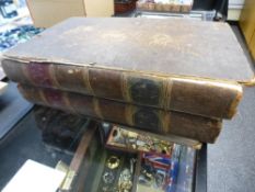 The family Bible circa 1800 in two volumes, brown full leather bindings,