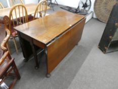 A Georgian mahogany two flap dining table having six turned legs with pad feet, width 121cms