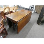 A Georgian mahogany two flap dining table having six turned legs with pad feet, width 121cms