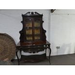 An early 20th century mahogany display cabinet, the base having two long drawers and lower shelf