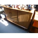 An Ercol elm sideboard, 114cm