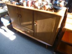 An Ercol elm sideboard, 114cm