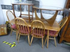 An Ercol light elm oblong dining table, 151cms and a set of our Ercol stick back chairs