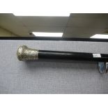 A ebony walking stick having silver knob