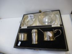 A Cruet set hallmarked Birmingham 1937 S Blanckensee and Son Ltd. along with two pierced silver