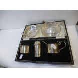 A Cruet set hallmarked Birmingham 1937 S Blanckensee and Son Ltd. along with two pierced silver