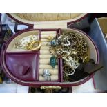 A quantity of costume jewellery contained within a burgundy Leather case