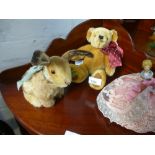 A Steiff seated rabbit, a Merrythought teddy and a pin cushion doll