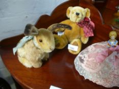 A Steiff seated rabbit, a Merrythought teddy and a pin cushion doll