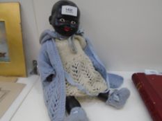 A black plaster doll fully dressed, rare, as not many were made in 1960