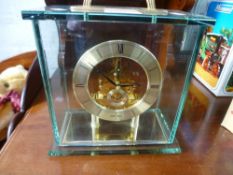 A modern Seiko mantel clock with glass case