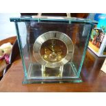 A modern Seiko mantel clock with glass case