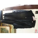 A ladies black faux fur coat